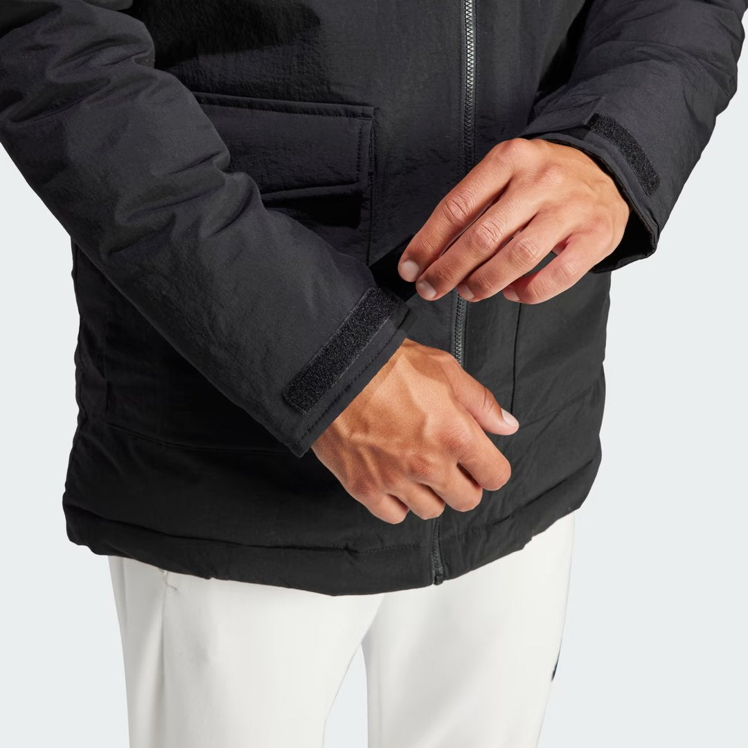 Detailed zoom on the lower part of the zipper, and sleeves of the Adidas Hooded Fur Parka,, highlighting the construction.
