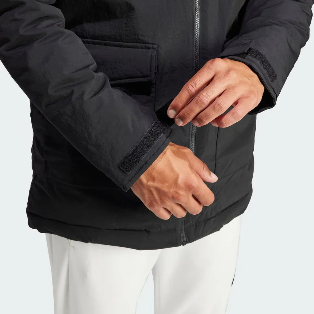 Detailed zoom on the lower part of the zipper, and sleeves of the Adidas Hooded Fur Parka,, highlighting the construction.