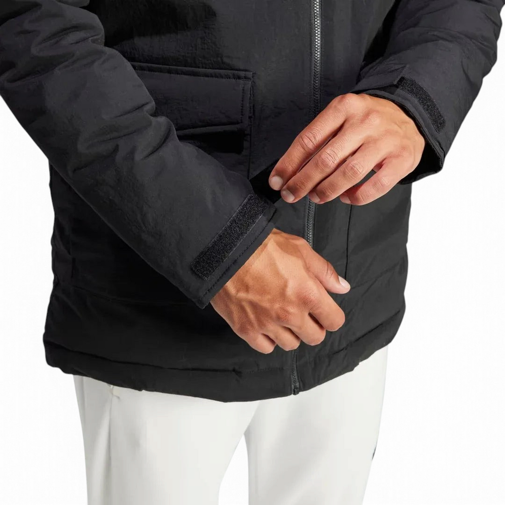 Detailed zoom on the lower part of the zipper, and sleeves of the Adidas Hooded Fur Parka,, highlighting the construction.
