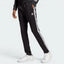 Highlights the high-velocity sweep of the iconic white 3-Stripes cascading down the professional depth of the slim black legs.