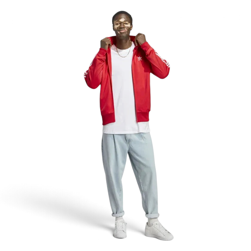 Model wearing the red adidas Firebird jacket
