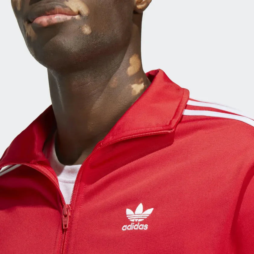 Detailed zoom on the ribbed stand-up collar and full zipper of the Adidas Adicolor Classics Firebird Track Jacket, highlighting its classic construction.