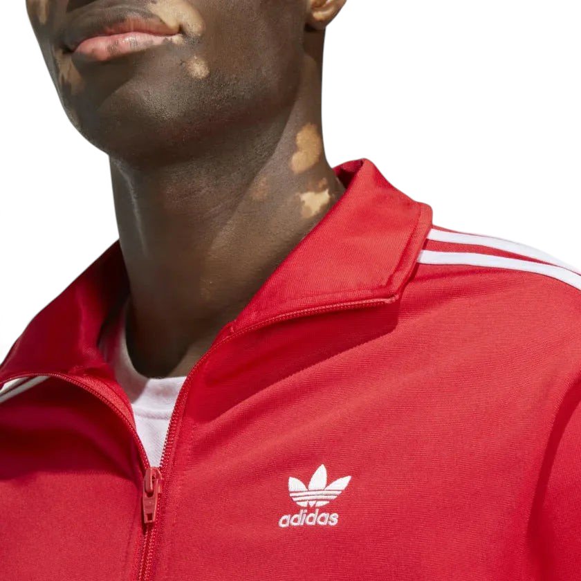Detailed zoom on the ribbed stand-up collar and full zipper of the Adidas Adicolor Classics Firebird Track Jacket, highlighting its classic construction.