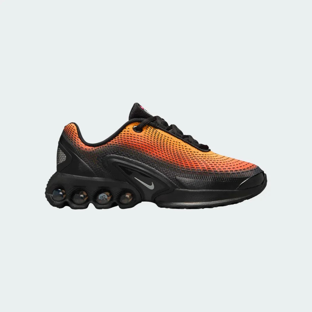 Nike Air Max DN Juniors' running trainers in black and light smoke grey, side profile showing visible Dynamic Air unit in the heel, textured upper, and sleek silhouette. Main image