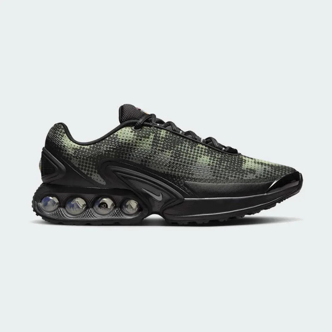Nike Air Max DN Men's running shoes in black, side profile showing visible Dynamic Air unit in the heel, textured upper, and sleek silhouette. Main image