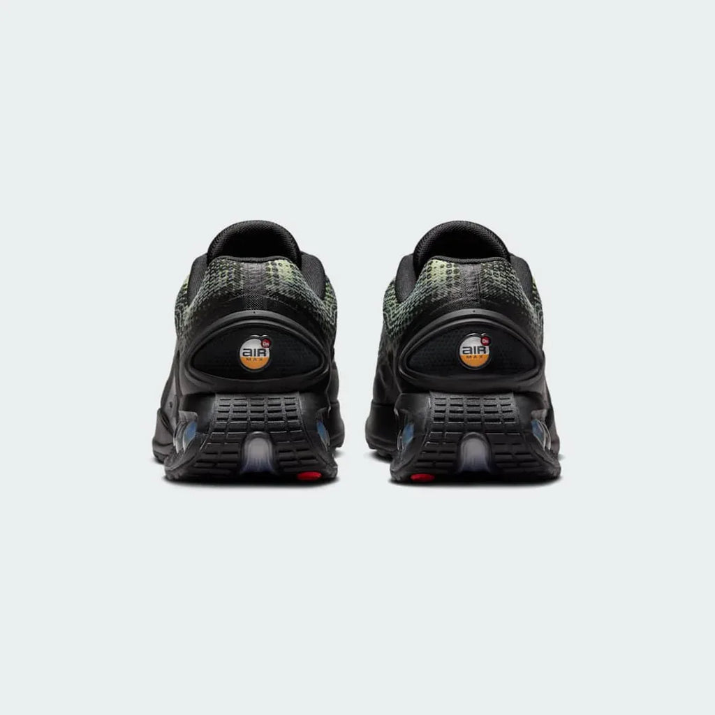 Rear view of the Nike Air Max DN Men's black running shoes, focusing on the visible Dynamic Air unit in the heel and molded heel counter.