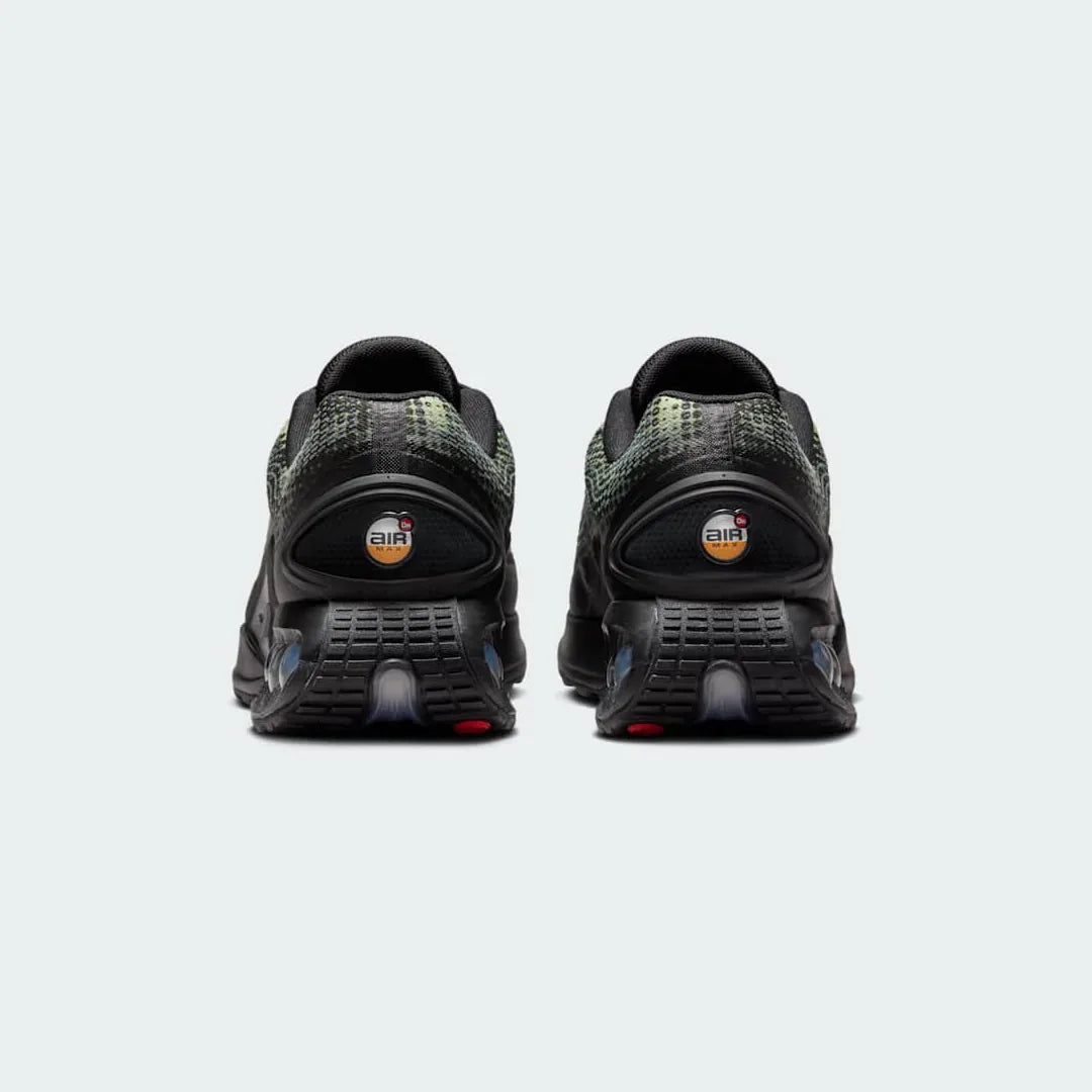 Rear view of the Nike Air Max DN Men's black running shoes, focusing on the visible Dynamic Air unit in the heel and molded heel counter.