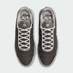 Top-down view of a pair of Nike Air Max Plus TN Men's trainers in brown and grey, highlighting their iconic silhouette and lace-up closure.