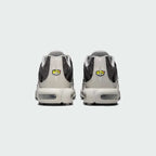 Rear view of the Nike Air Max Plus TN Men's trainers, focusing on the prominent Tuned Air branding on the heel and wavy design elements.