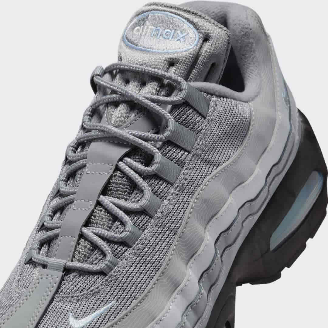 Close-up zoom on the front of the Nike Air Max 95 OG Men's running shoes, showing the intricate lacing system, mesh tongue, and layered overlays.
