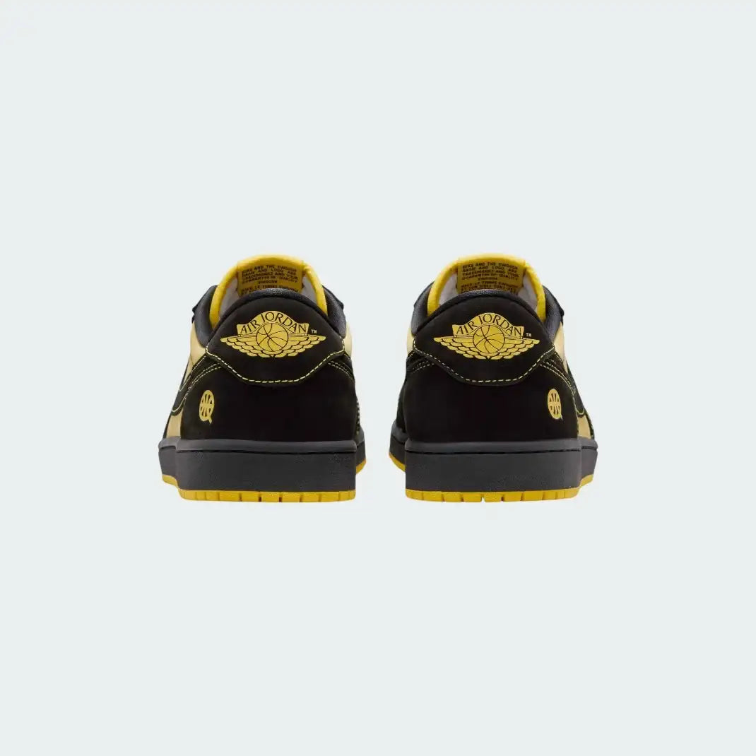 Rear view of the Air Jordan 1 Retro Low OG Q54 men's trainers, focusing on the embroidered Wings logo on the heel.