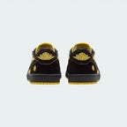 Rear view of the Air Jordan 1 Retro Low OG Q54 men's trainers, focusing on the embroidered Wings logo on the heel.