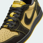 Close-up zoom on the front of the Air Jordan 1 Retro Low OG Q54 men's trainers, showing the perforated toe box, lacing system, and textured leather upper.