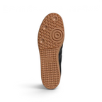 View of the classic gum rubber outsole, showcasing the heritage pivot-point traction pattern and the high-quality Italian construction.