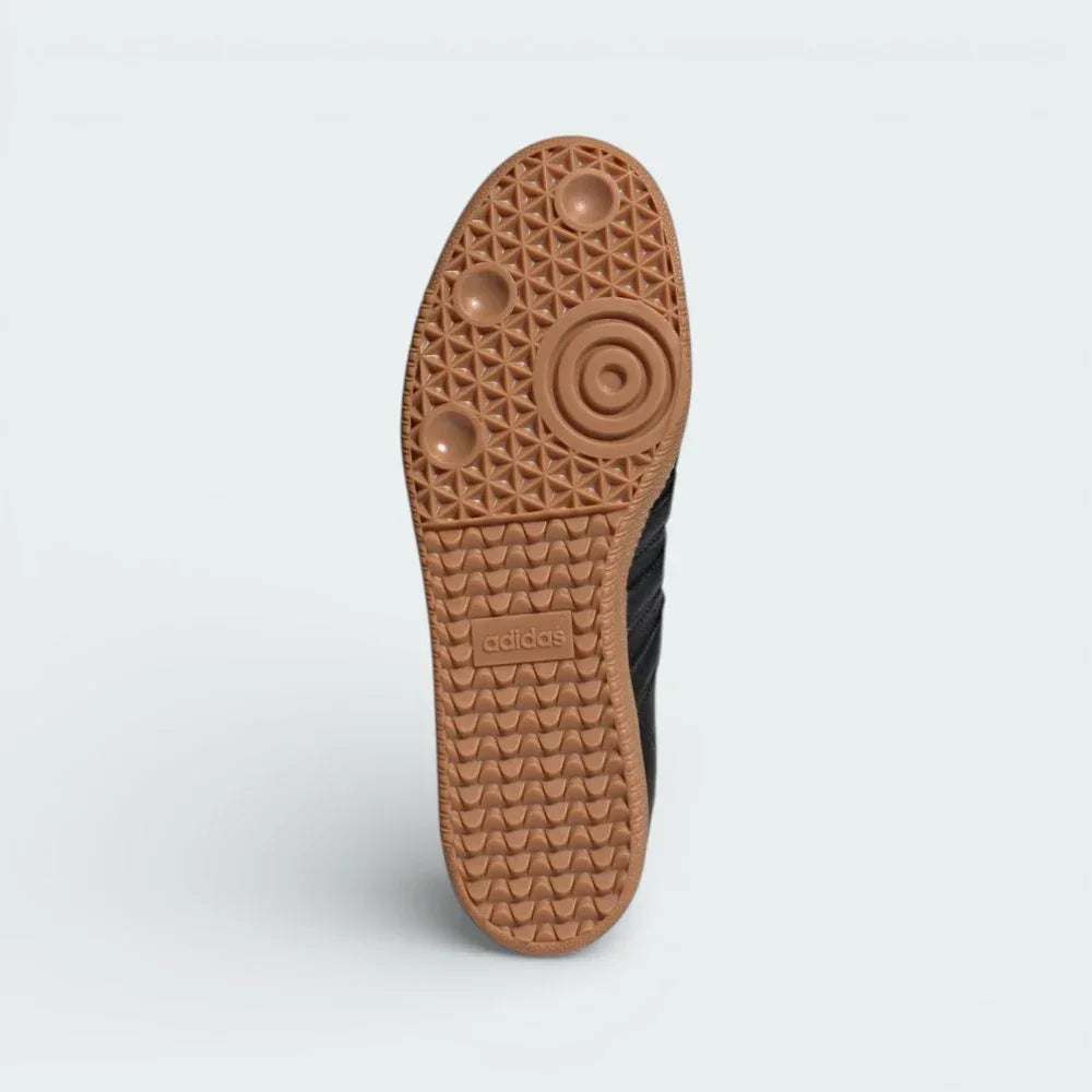 View of the classic gum rubber outsole, showcasing the heritage pivot-point traction pattern and the high-quality Italian construction.