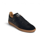 Angled shot of the Samba OG Made In Italy shoes, showcasing the refined silhouette and the contrast between the black leather and gum accents.