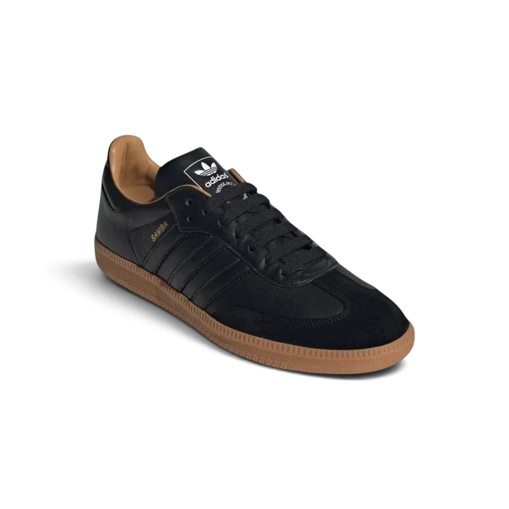 Angled shot of the Samba OG Made In Italy shoes, showcasing the refined silhouette and the contrast between the black leather and gum accents.