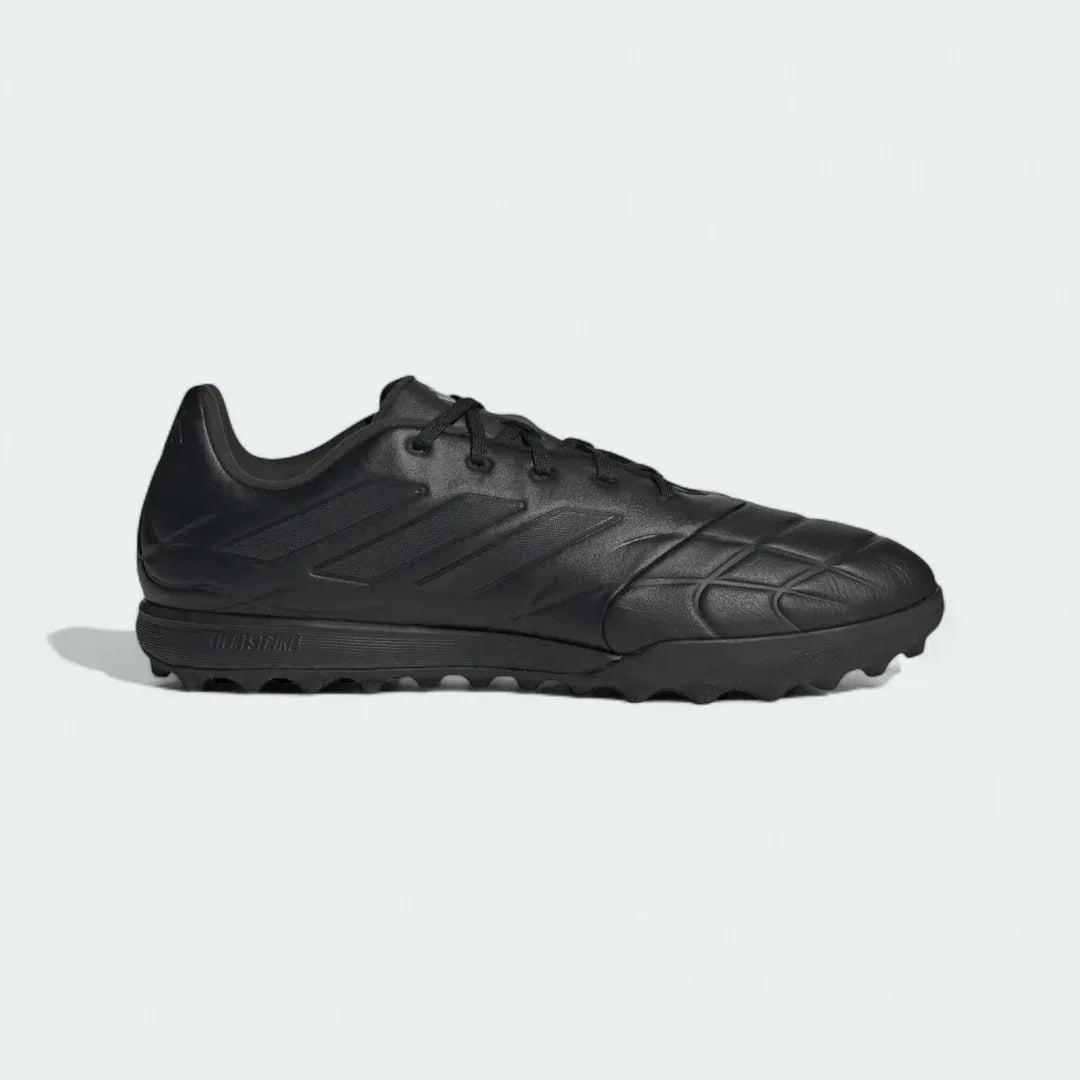 Adidas Copa Pure.3 Turf Men's football boots in black with a white heel, side profile showing the synthetic upper and turf-specific rubber outsole. Main image