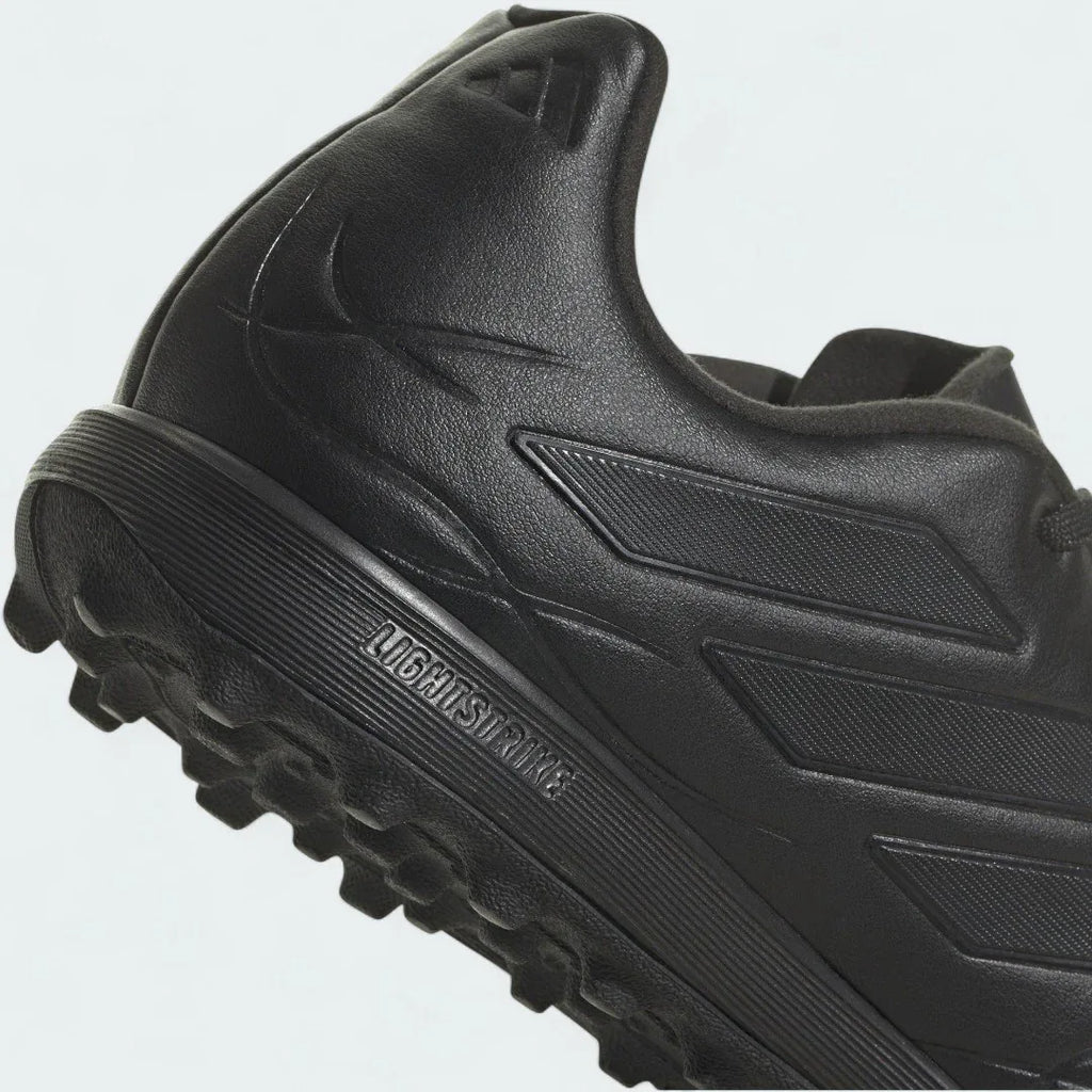 Detailed zoom on the outsole and midsole of the Adidas Copa Pure.3 Turf Men's boots, highlighting the cushioned EVA foam and rubber sole.