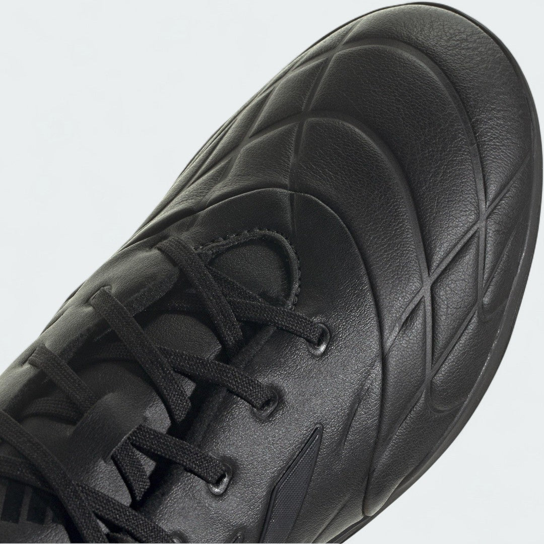 Close-up zoom on the front of the Adidas Copa Pure.3 Turf Men's boots, showing the textured upper and lacing system.