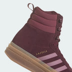 Highlighting the textured nature of the rubber and the high-quality gold foil detailing.