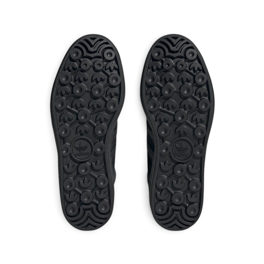 Displays the classic geometric tread matrix of the rubber outsole engineered for unreal multi-directional street grip.