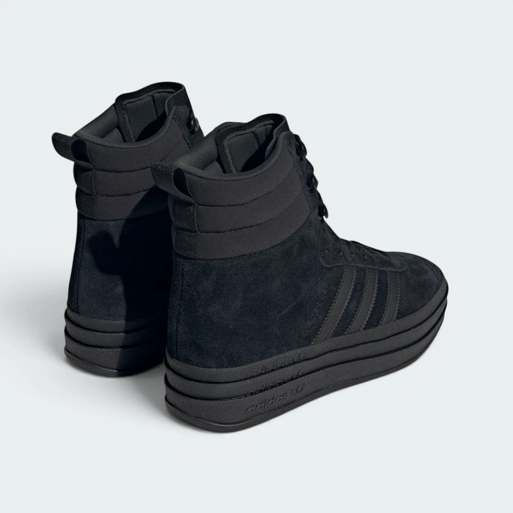 Focuses on the clean layout of the stacked platform layers from the rear and the neat finish of the heel panel stitching.