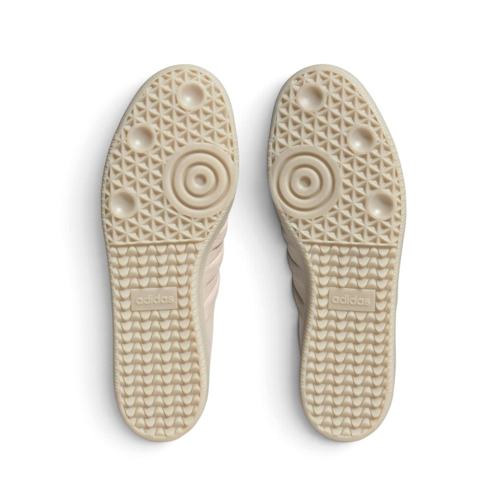 Outsole View: Bottom-down view of the translucent amber gum rubber outsole, showcasing the classic tread pattern, pivot circles, and central embossed adidas branding.   