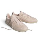 Angle View Showing Details Side by Side: Angled front-three-quarter perspective capturing the clean tonal toe overlay, smooth side panels, and integrated minimalist striping.   