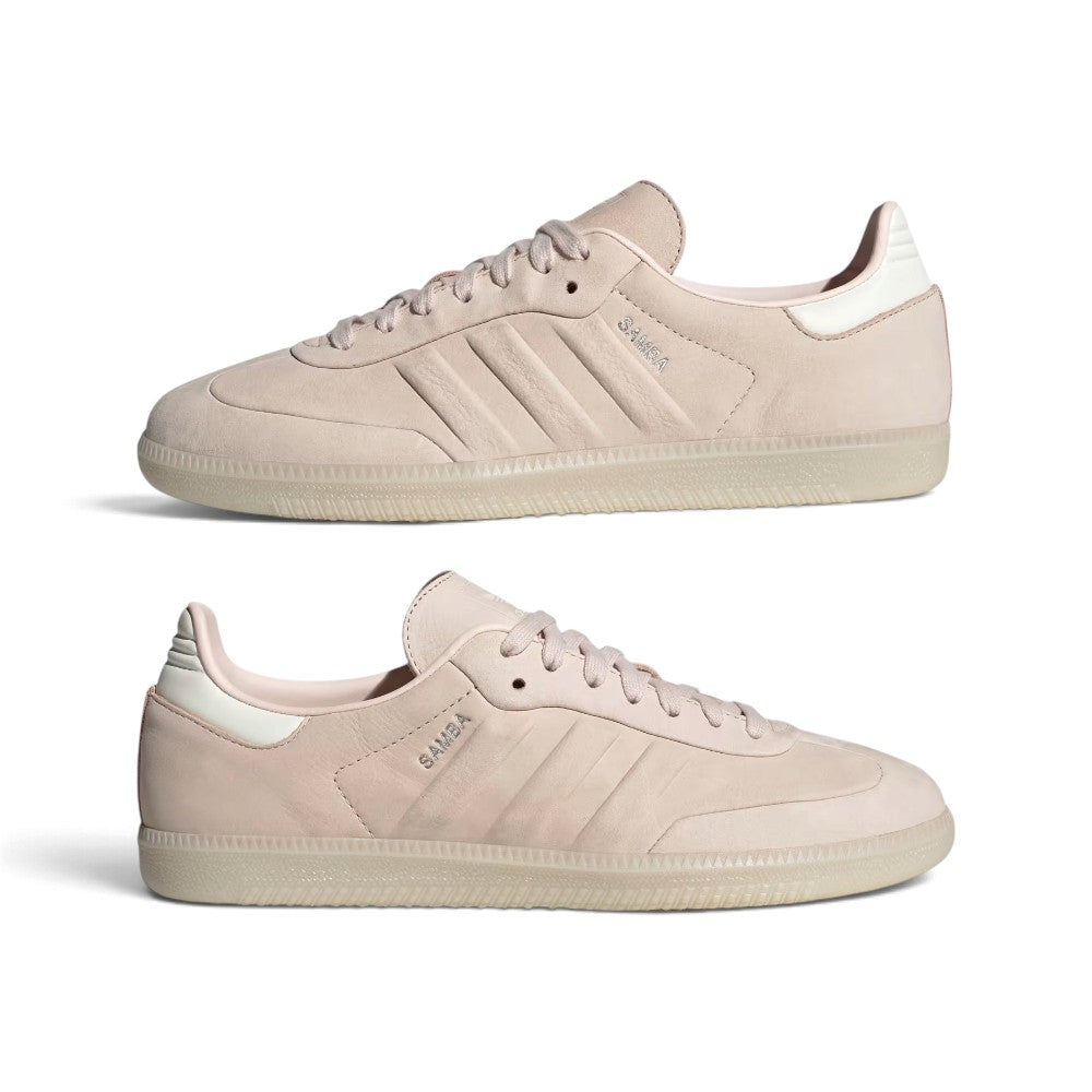 A pair of Adidas Samba sneakers in a light beige suede and nubuck material, shown from the side on a clean white background.