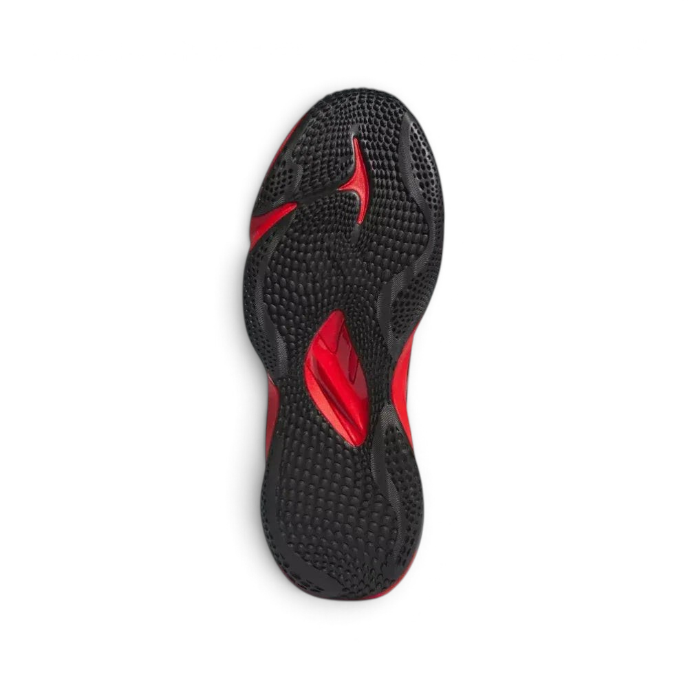 View of the rubber outsole, showcasing the multi-directional grip pattern designed for explosive turf movements.