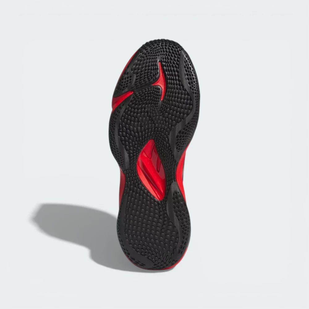 View of the rubber outsole, showcasing the multi-directional grip pattern designed for explosive turf movements.