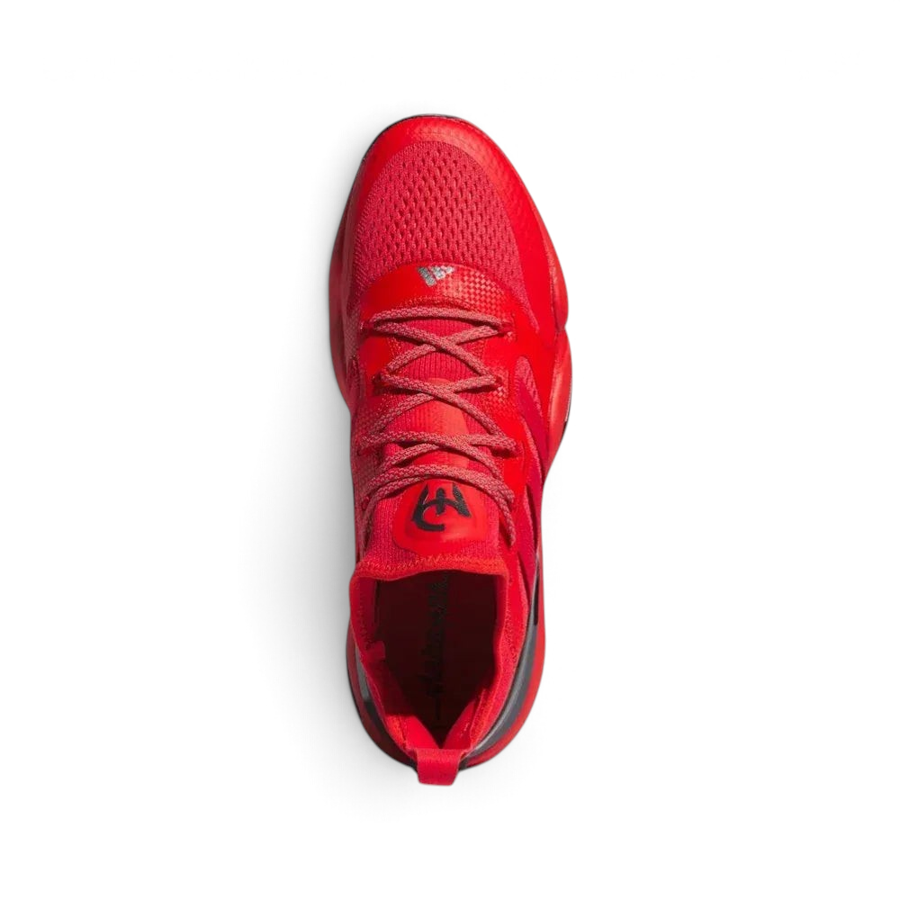 Top-down view of the red training shoes, highlighting the integrated lacing system and the textile tongue detailing.