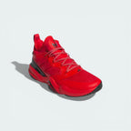 Angled shot of the Mahomes signature shoes, showcasing the vibrant red colourway and the structured heel support.