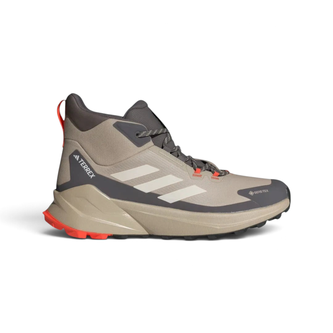 Highlights the high-velocity lines of the seamless overlays, the crisp Terrex branding, and the professional look of the mid-height ankle cuff resting above the charcoal mudguard. Main image