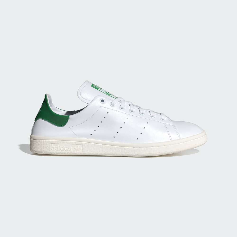Side Profile Image: The Cloud White Stan Smith Decon, highlighting the thin, premium leather and the classic green heel tab.