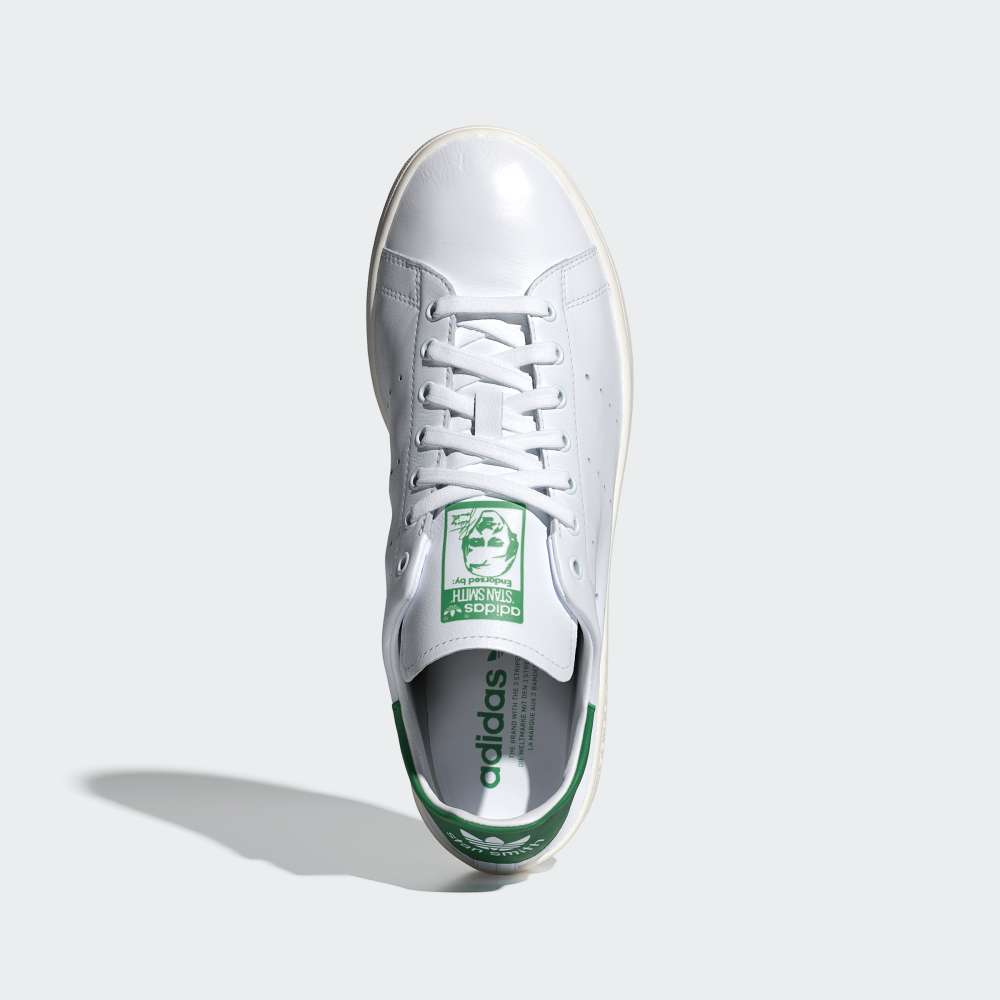 Top-Down View of Pair: Looking down at the unlined leather tongue and the iconic green Stan Smith portrait branding.