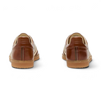 Focusing on the reinforced heel stitching and the clean, handcrafted finish of the Italian workshop.