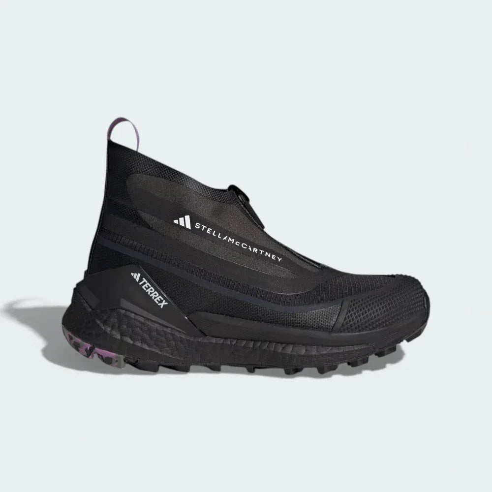Side profile of the black and lilac Stella McCartney x Terrex Free Hiker, showing the elongated fashion-forward silhouette and the chunky BOOST midsole. Main image