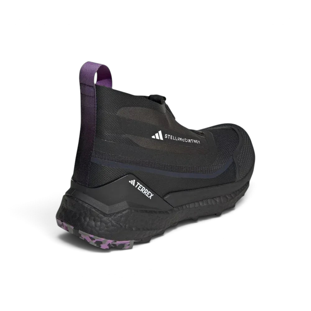 Rear view focusing on the external heel clip for stability and the protective height of the sock-like collar.