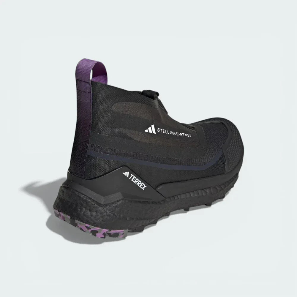 Rear view focusing on the external heel clip for stability and the protective height of the sock-like collar.