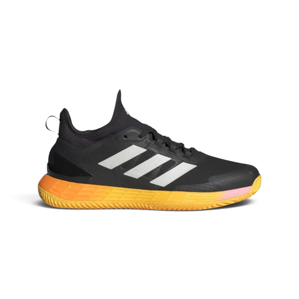Side profile of the adidas Adizero Ubersonic 4.1 Clay in Aurora Black, showing the Zero Metallic three stripes and the vibrant Spark neon accents on the midsole. Main image