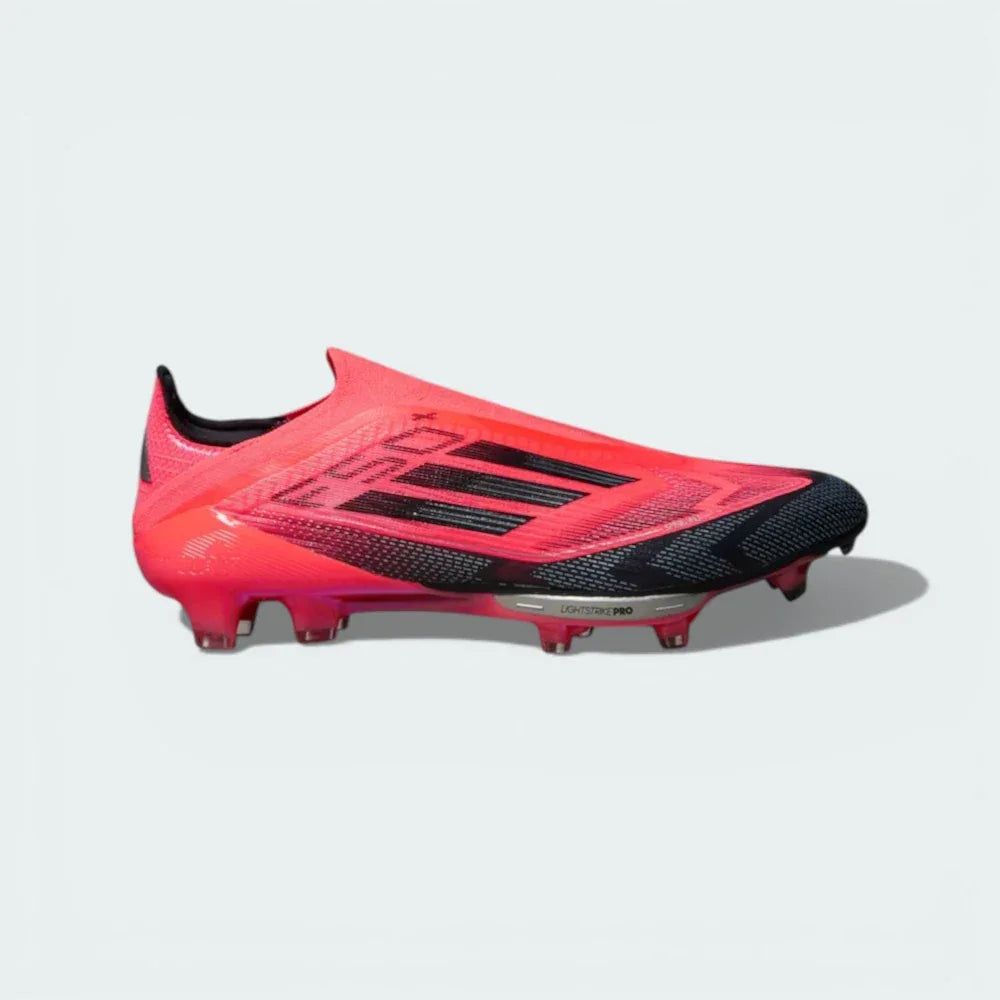 Side profile of the Turbo Red adidas F50+ FG, showing the aerodynamic Fibertouch upper and the iridescent Platinum Metallic 3-Stripes. Main image