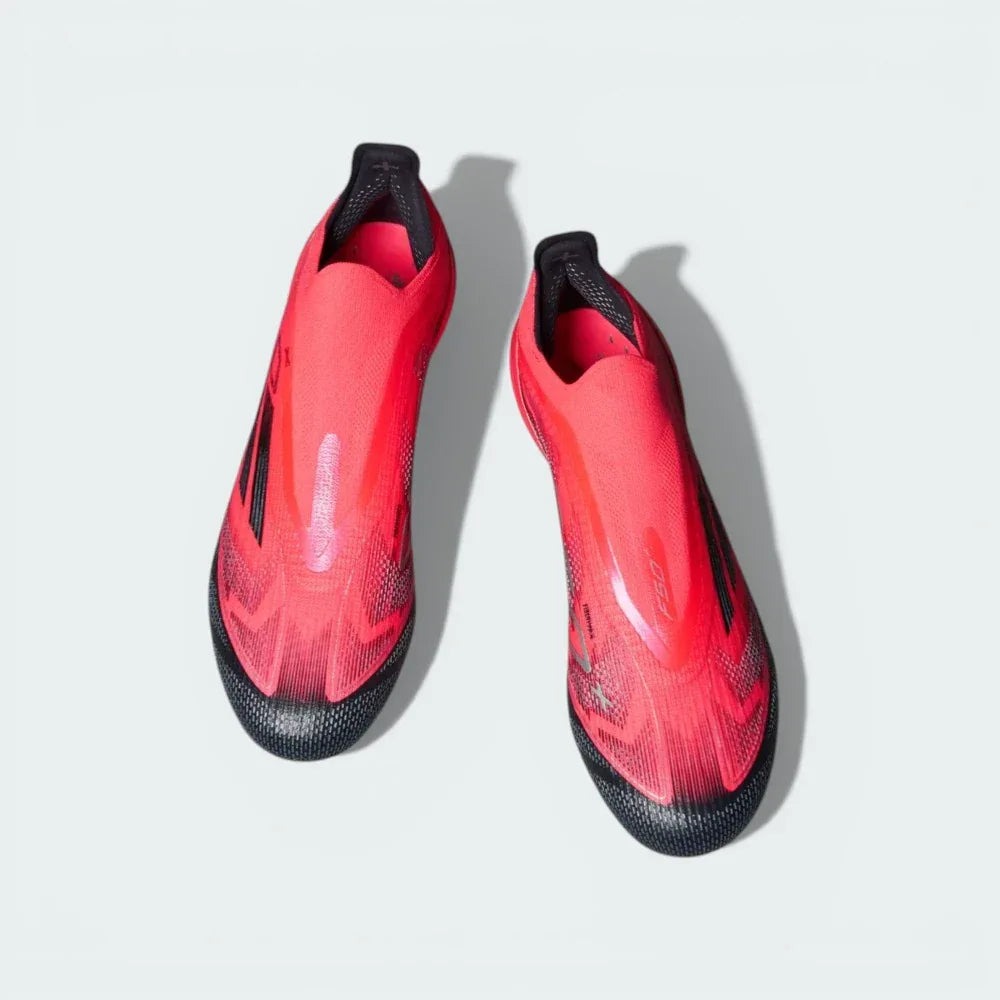 Top-down view of the laceless F50+ boots, highlighting the integrated Primeknit collar and the textured Sprintweb 3D grip pattern.
