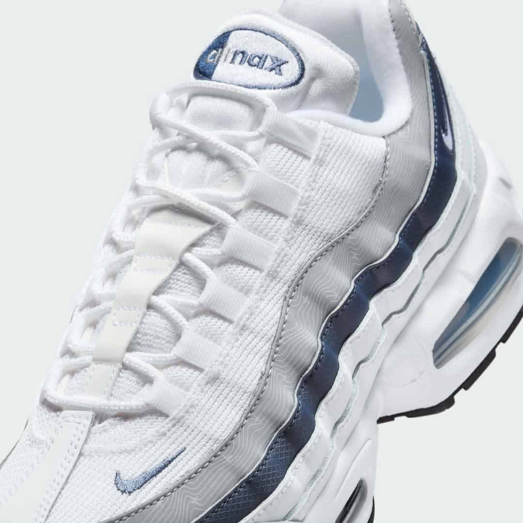 Close-up zoom on the front of the Nike Air Max 95 OG Men's running shoes, showing the intricate lacing system, mesh tongue, and layered overlays.