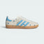 Highlights the high-velocity sweep of the Light Blue serrated 3-Stripes intertwined with the professional, high-definition embroidery of the colorful floral details on the Light Brown suede.