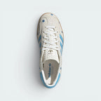 Focuses on the tidy lace closure layout, the clean alignment of the soft light brown suede tongue, and the iconic T-toe panel covering the front box.