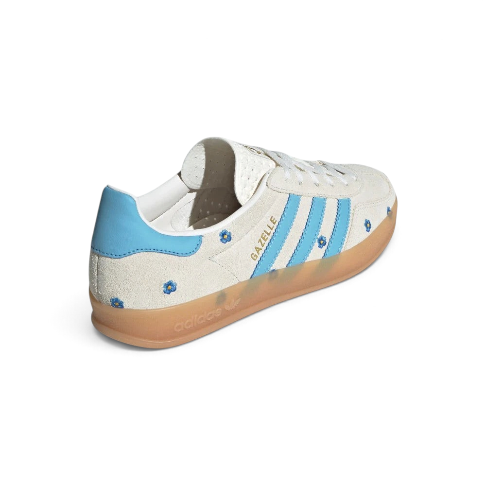 Focuses on the contoured shape of the blue leather heel counter and the clean finish of the wrapping translucent rubber sole wall.