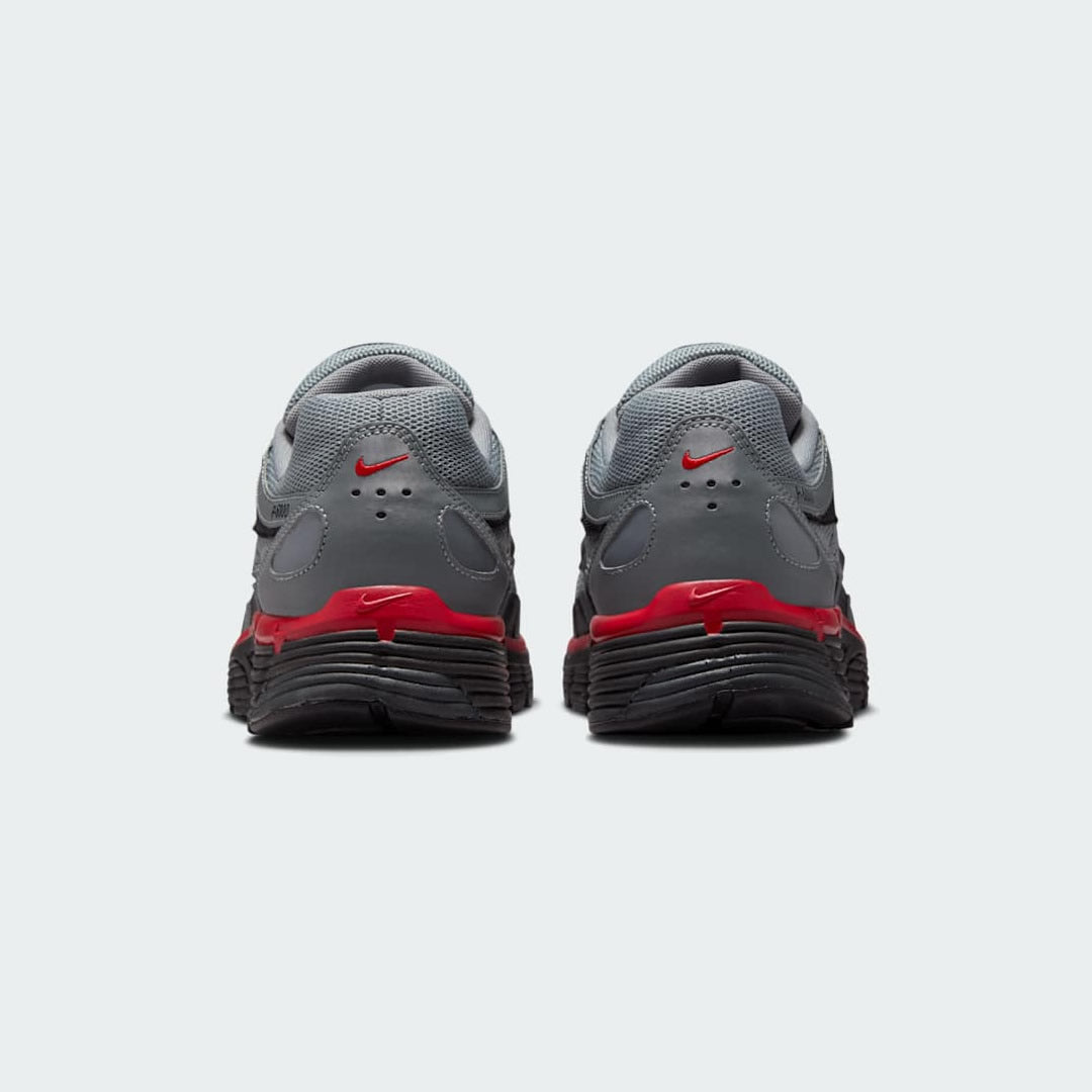 Rear view of the Nike P-6000 SE men's trainers, focusing on the heel design, layered materials, and subtle branding.