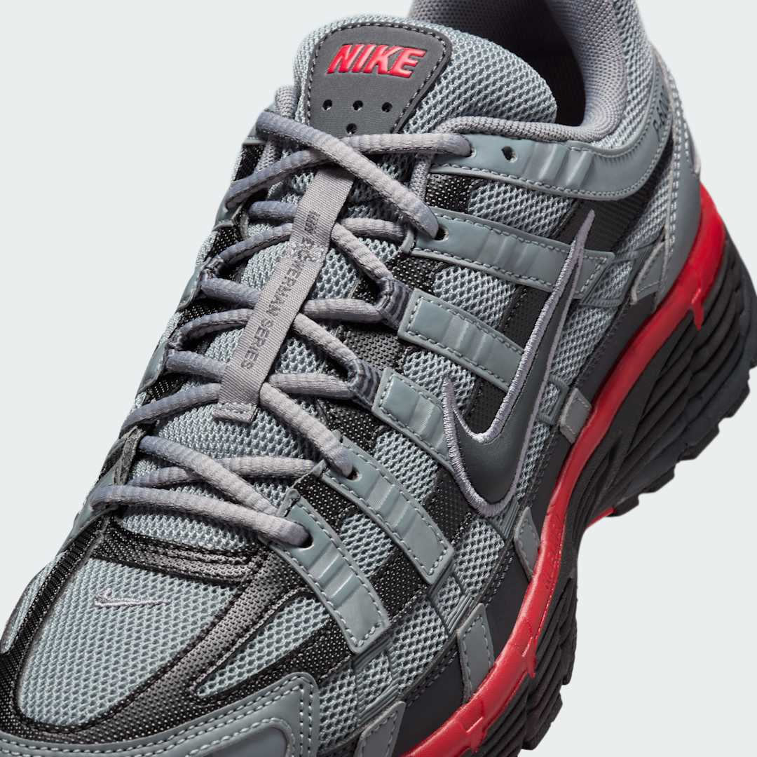 Close-up zoom on the front of the Nike P-6000 SE men's trainers, showing the intricate mesh base, layered overlays, and lacing system.